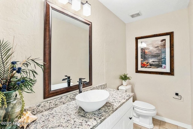 100 Woods S Dr, Merritt Island, FL 32952 - bathroom with visible vents, tile patterned flooring, vanity, baseboards, and toilet