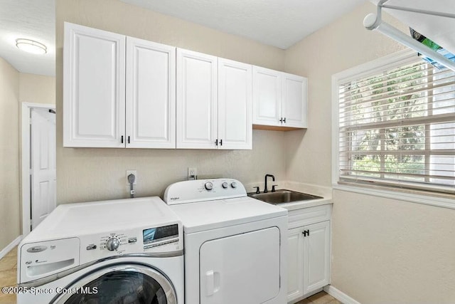 100 Woods S Dr, Merritt Island, FL 32952 - clothes washing area featuring a sink, separate washer and dryer, baseboards, and cabinet space