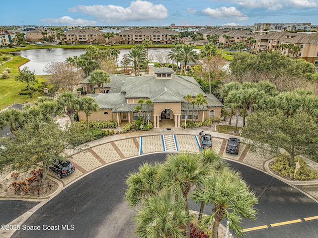 birds eye view of property featuring a water view