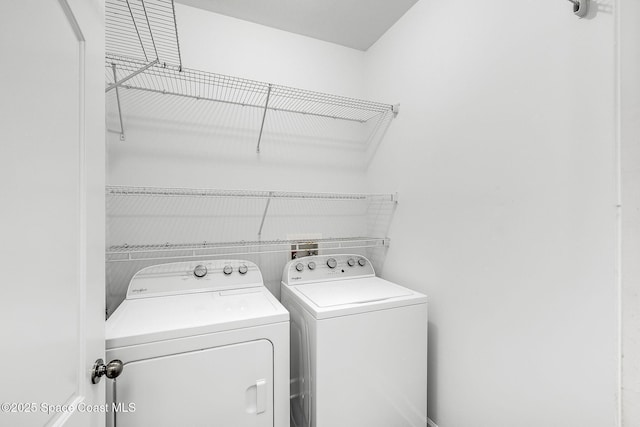 clothes washing area with laundry area and washing machine and clothes dryer