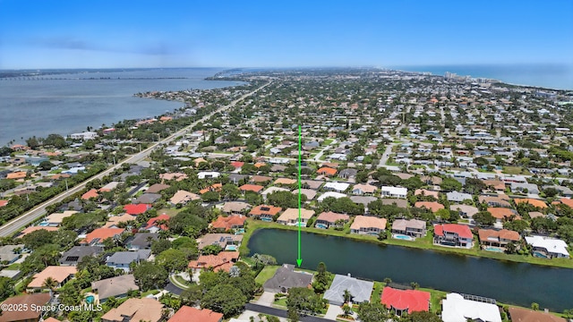 aerial overview of property's location featuring a nearby body of water and nearby suburban area