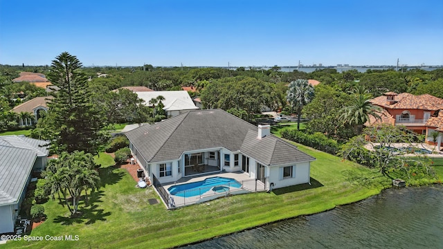 view from above of property featuring a large body of water and a tree filled landscape