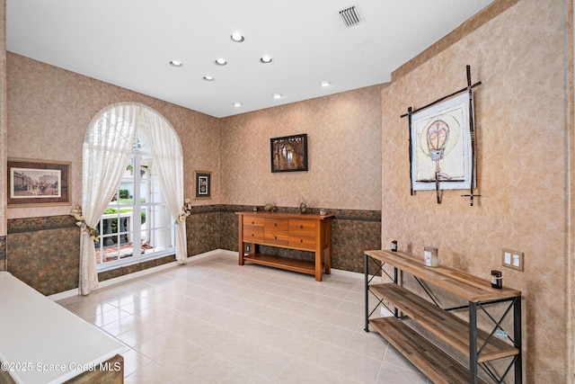 living area featuring wallpapered walls, recessed lighting, baseboards, and light tile patterned floors