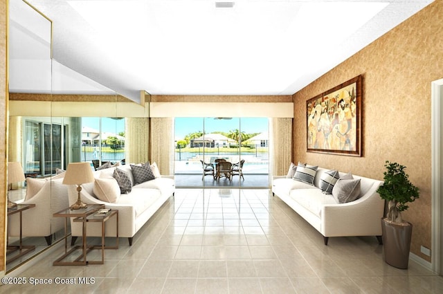tiled living area featuring a water view and healthy amount of natural light