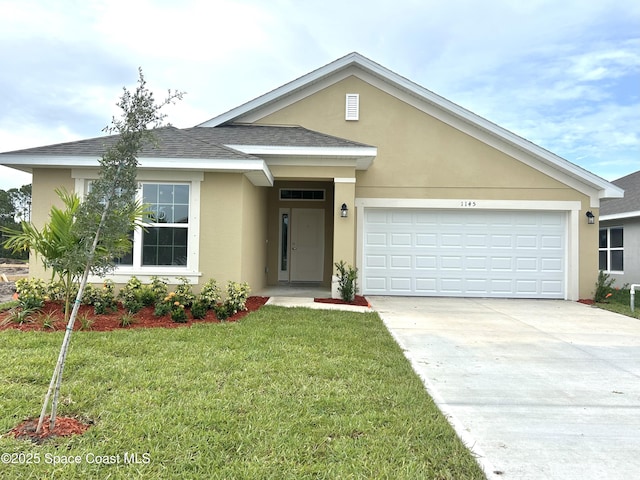 1145 Kylar Dr NW, Palm Bay, FL 32907 - view of front of home with stucco siding, concrete driveway, a front yard, and a garage