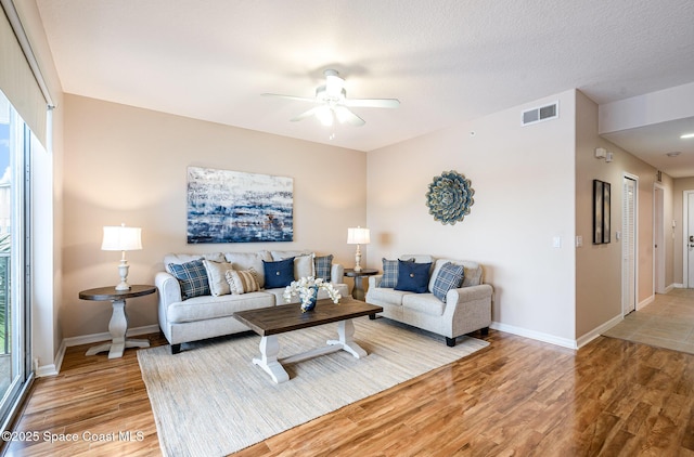 6838 Toland Dr Unit 307, Melbourne, FL 32940 - living area featuring ceiling fan, light wood finished floors, and baseboards