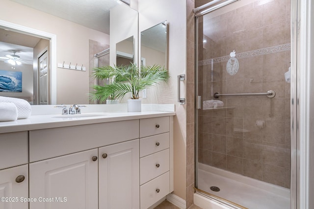 6838 Toland Dr Unit 307, Melbourne, FL 32940 - full bath featuring a stall shower, vanity, and ceiling fan