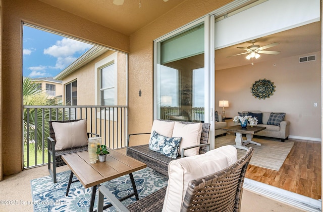 6838 Toland Dr Unit 307, Melbourne, FL 32940 - balcony with ceiling fan and an outdoor living space