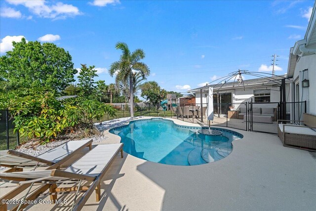 216 Cynthia Ln, Indian Harbour Beach, FL 32937 - view of pool featuring a patio area, a fenced backyard, and a fenced in pool