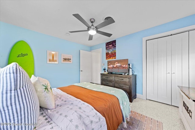 216 Cynthia Ln, Indian Harbour Beach, FL 32937 - bedroom with speckled floor, ceiling fan, a closet, and baseboards