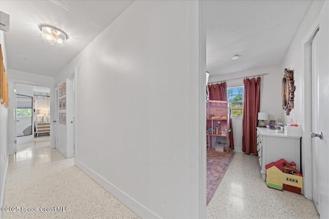 216 Cynthia Ln, Indian Harbour Beach, FL 32937 - corridor with baseboards and light speckled floor