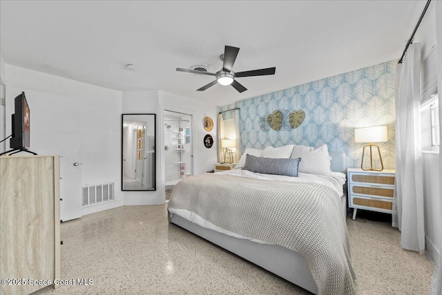 216 Cynthia Ln, Indian Harbour Beach, FL 32937 - bedroom with visible vents, wallpapered walls, an accent wall, and speckled floor