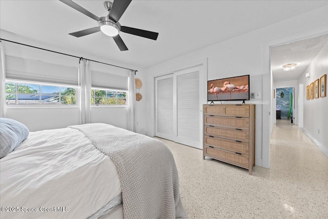 216 Cynthia Ln, Indian Harbour Beach, FL 32937 - bedroom featuring a closet, ceiling fan, and light speckled floor