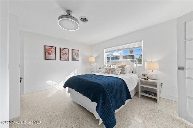 216 Cynthia Ln, Indian Harbour Beach, FL 32937 - bedroom featuring visible vents, baseboards, and speckled floor