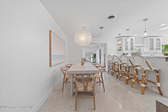 216 Cynthia Ln, Indian Harbour Beach, FL 32937 - dining space featuring visible vents, baseboards, and light speckled floor
