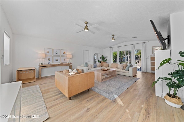 216 Cynthia Ln, Indian Harbour Beach, FL 32937 - living room with visible vents, light wood finished floors, vaulted ceiling, and a ceiling fan