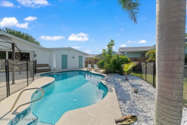 216 Cynthia Ln, Indian Harbour Beach, FL 32937 - view of swimming pool with a fenced backyard, a fenced in pool, and a patio