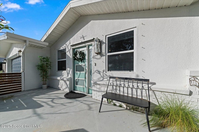 216 Cynthia Ln, Indian Harbour Beach, FL 32937 - view of exterior entry featuring stucco siding