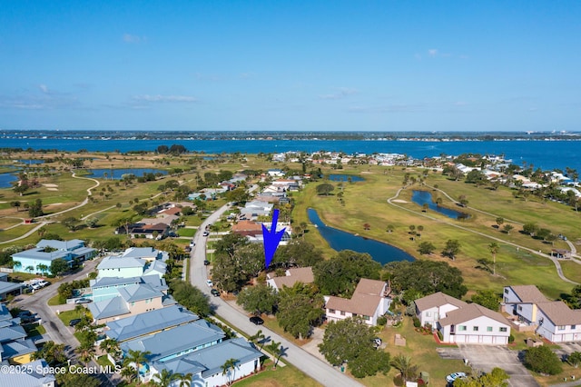 aerial overview of property's location featuring a nearby body of water and a golf club