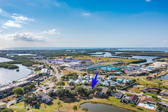 aerial view of property and surrounding area with a large body of water