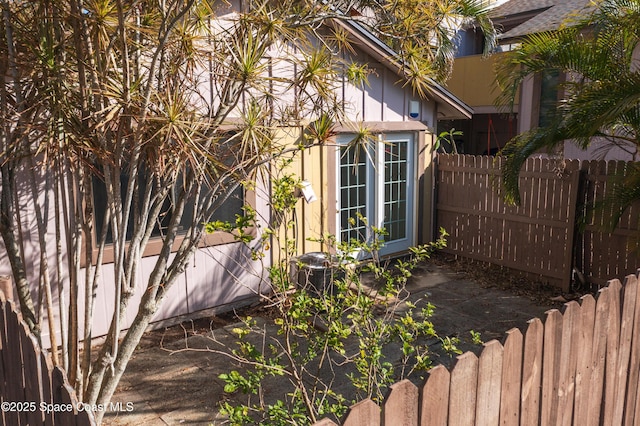 view of property exterior featuring fence