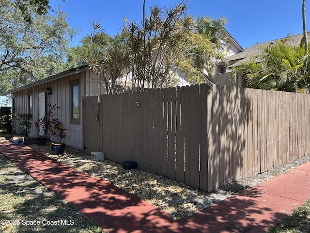 view of home's exterior with fence and board and batten siding