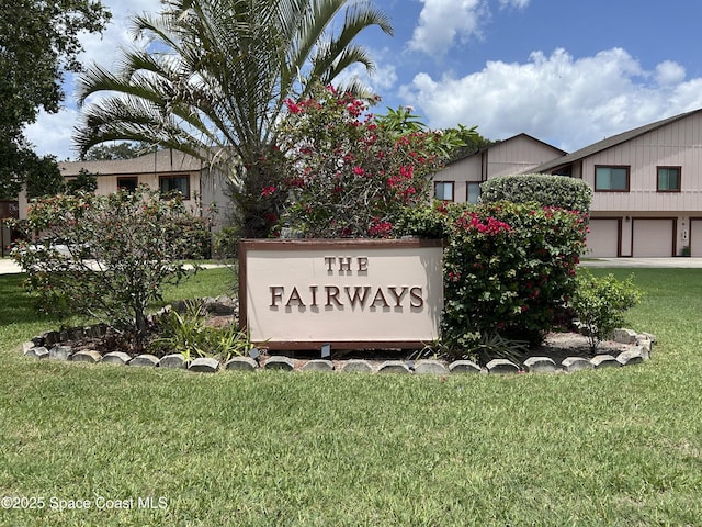 5 Fairway Dr Unit 5, Cocoa Beach, FL 32931 - community / neighborhood sign featuring a yard and a garage