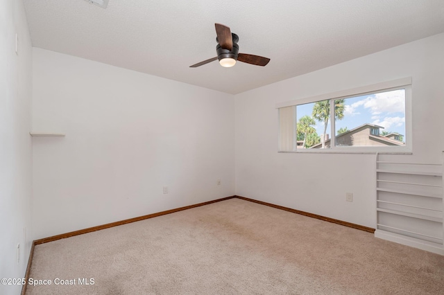 3021 Kirkland Rd NE, Palm Bay, FL 32905 - carpeted empty room with a ceiling fan and baseboards