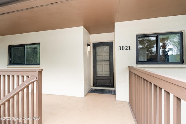 3021 Kirkland Rd NE, Palm Bay, FL 32905 - entrance to property featuring stucco siding