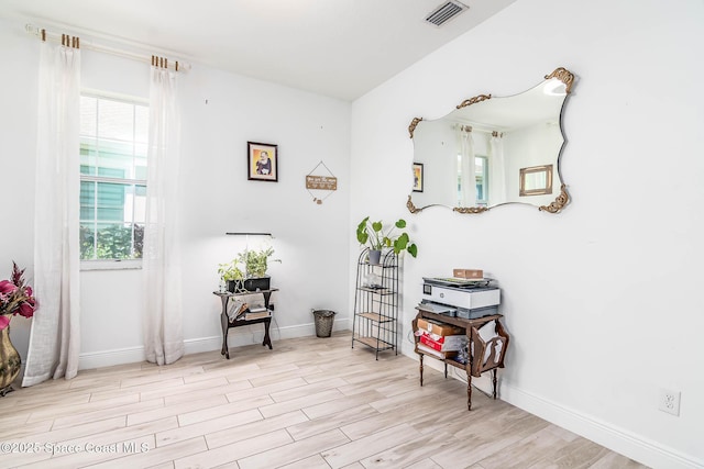 7921 Mocan Ct, Melbourne, FL 32940 - sitting room featuring wood finished floors and baseboards