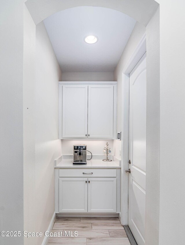 7921 Mocan Ct, Melbourne, FL 32940 - washroom with arched walkways and baseboards