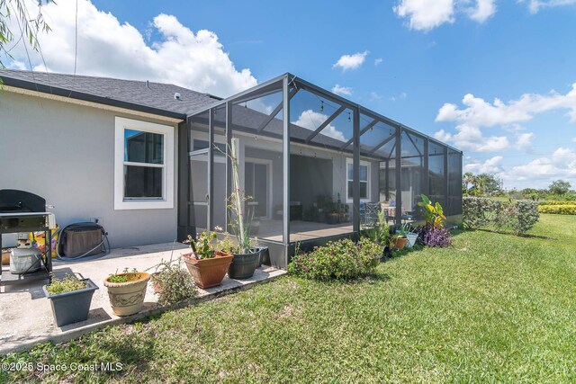 7921 Mocan Ct, Melbourne, FL 32940 - rear view of property with a patio, a yard, roof with shingles, and stucco siding