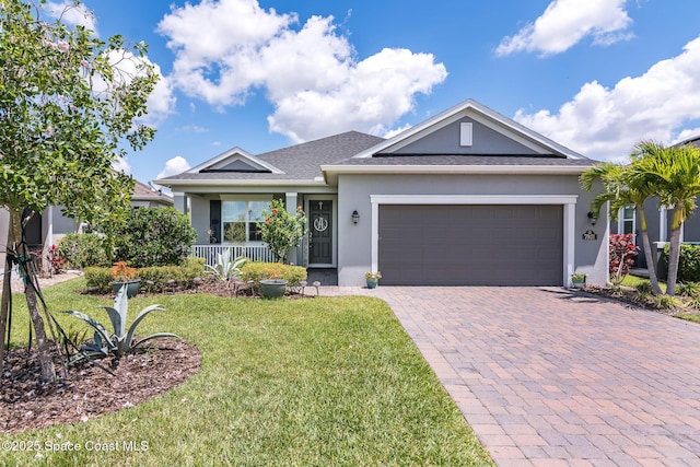 7921 Mocan Ct, Melbourne, FL 32940 - single story home with stucco siding, a front yard, decorative driveway, a porch, and an attached garage
