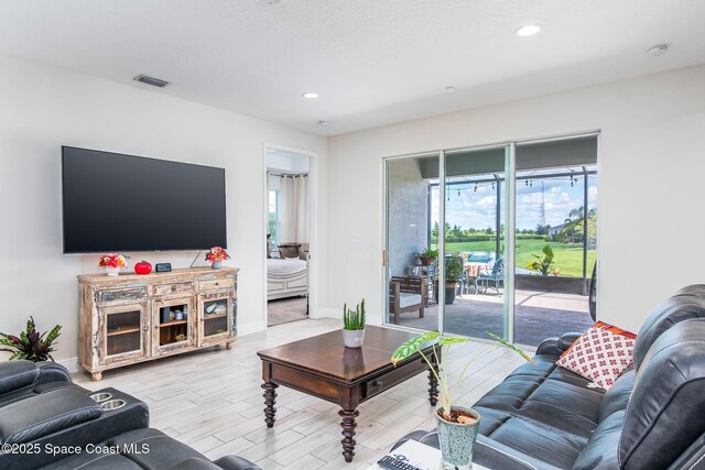 7921 Mocan Ct, Melbourne, FL 32940 - living area with recessed lighting, wood finished floors, and baseboards