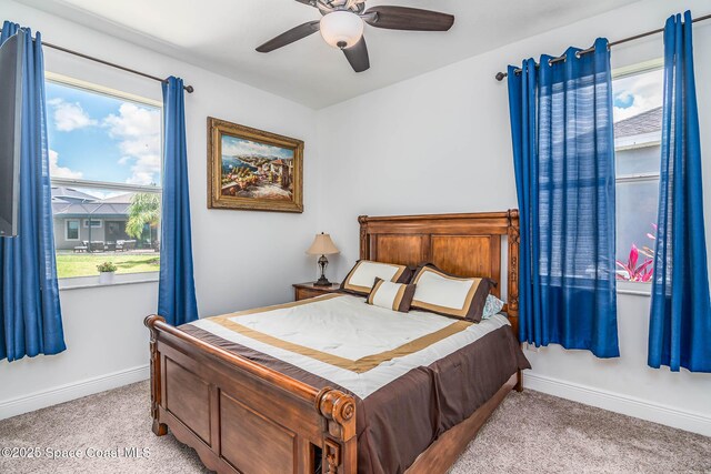 7921 Mocan Ct, Melbourne, FL 32940 - bedroom featuring light colored carpet, baseboards, and a ceiling fan