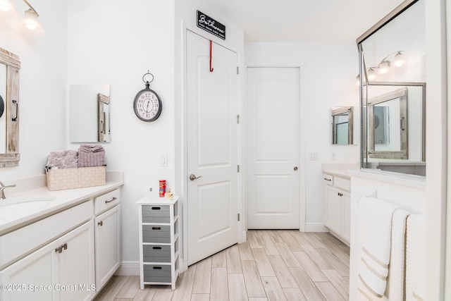 7921 Mocan Ct, Melbourne, FL 32940 - full bath featuring wood finished floors, vanity, and baseboards