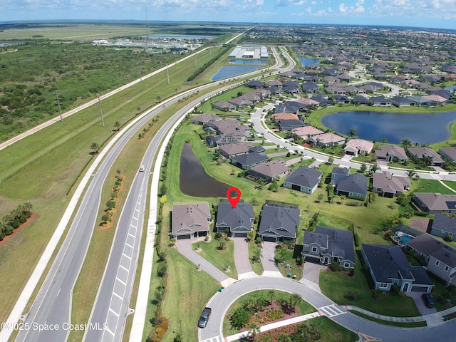 7921 Mocan Ct, Melbourne, FL 32940 - aerial overview of property's location featuring a large body of water and nearby suburban area