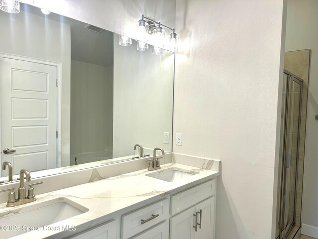 1125 Kylar Dr NW, Palm Bay, FL 32907 - full bathroom featuring double vanity and a stall shower