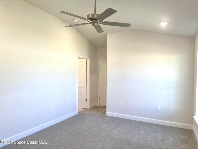 1125 Kylar Dr NW, Palm Bay, FL 32907 - unfurnished bedroom featuring baseboards, carpet flooring, lofted ceiling, and a ceiling fan