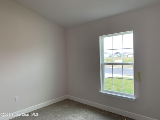 1005 Kylar Dr NW, Palm Bay, FL 32907 - spare room with baseboards and carpet