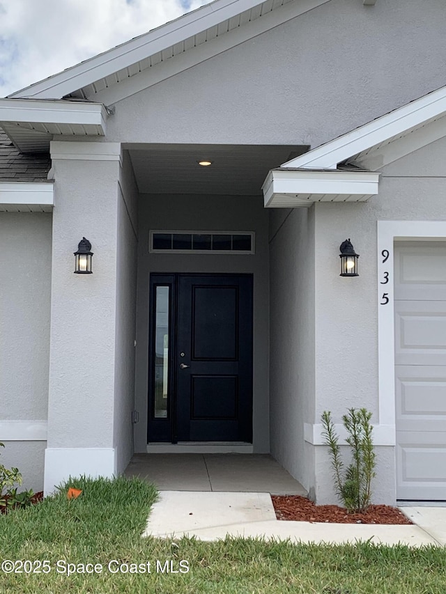 1005 Kylar Dr NW, Palm Bay, FL 32907 - view of exterior entry with stucco siding
