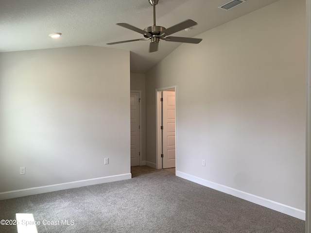 1005 Kylar Dr NW, Palm Bay, FL 32907 - carpeted spare room featuring visible vents, a ceiling fan, baseboards, and vaulted ceiling