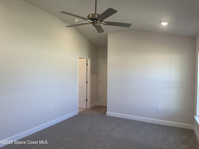 1128 Soleway Ave, Palm Bay, FL 32907 - spare room featuring ceiling fan, baseboards, vaulted ceiling, and carpet floors