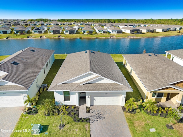 bird's eye view featuring a residential view and a water view
