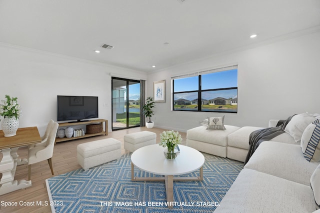 living room featuring baseboards, visible vents, recessed lighting, wood finished floors, and ornamental molding