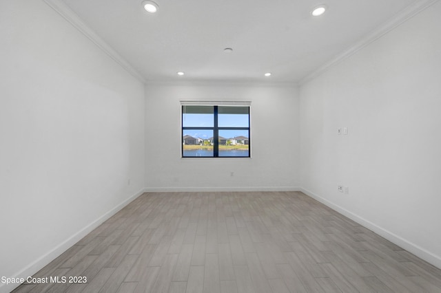 unfurnished room with baseboards, ornamental molding, light wood-style floors, and recessed lighting