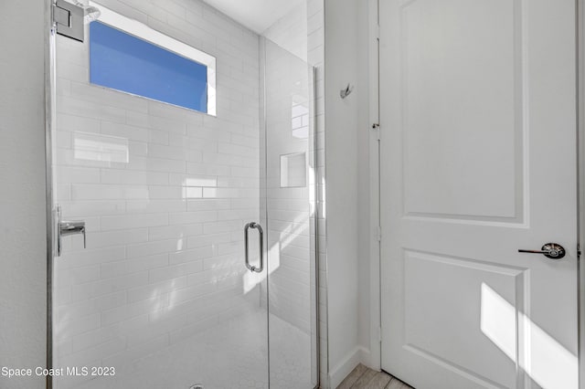 bathroom with a stall shower