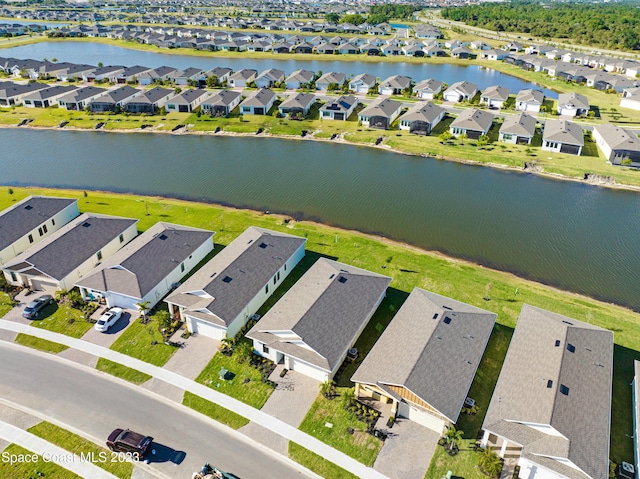 aerial view featuring a residential view and a water view