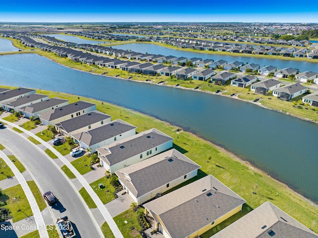 aerial view with a residential view and a water view