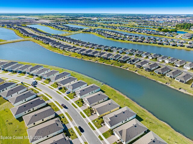 aerial view with a residential view and a water view